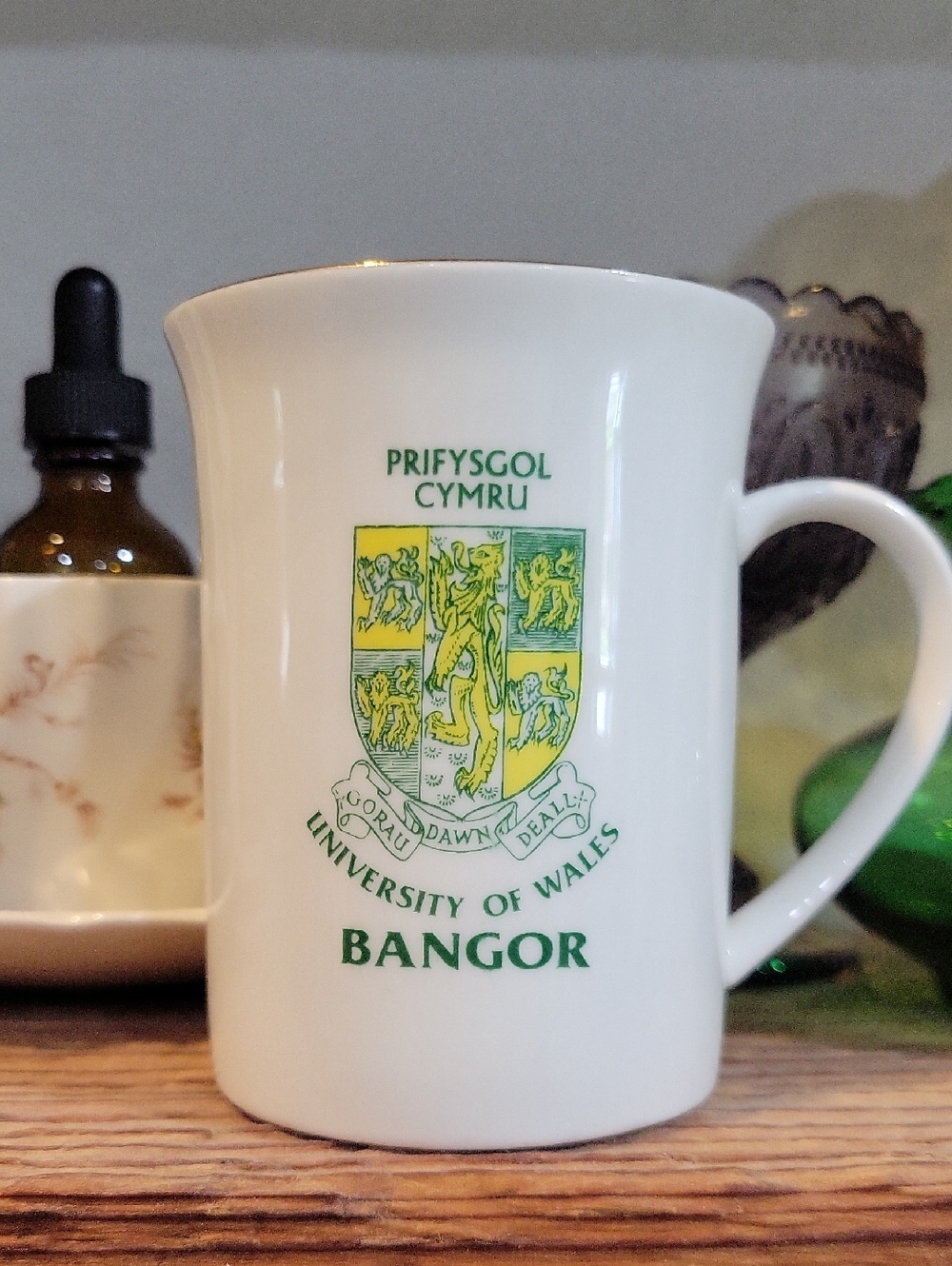 University of Wales Bangor Crest Mug - White with Green & Yellow Crest